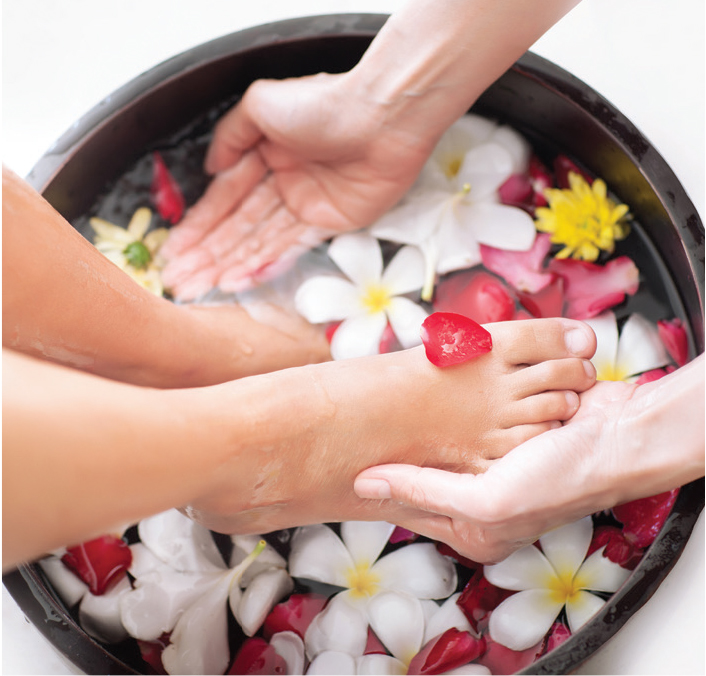 Use an electric foot spa with bubbles or a bucket with marbles... 